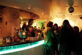 Friends laughing at chilling by the bar at Dolce Vita in Florence.