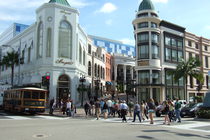 Crowds of people enjoying (and spending all their money at) the shops on Rodeo Drive in Beverly Hills.
