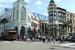 Crowds of people enjoying (and spending all their money at) the shops on Rodeo Drive in Beverly Hills.