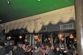 Lining up along the bar waiting to get a drink at the at The Dogstar in Brixton. 