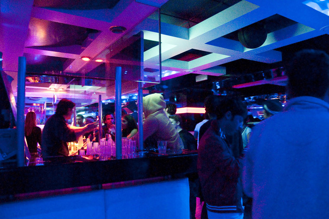 People getting drinks at the bar at Yab in Florence. 