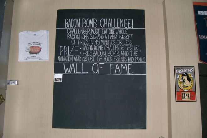 Bacon Bomb Challenge Wall of Fame at Paddy Long's.  Challenger must eat one whole Bacon Bomb (5 lbs) and a large basket of fries in 45 min. or less.